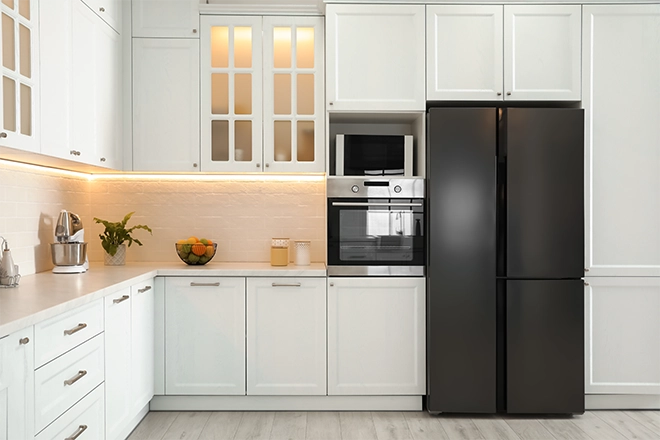 Kitchen with cabinets above the refrigerator