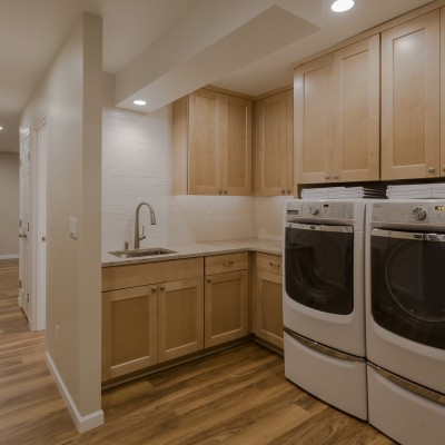 statements tile white matte laundry Bothell Basement Remodel