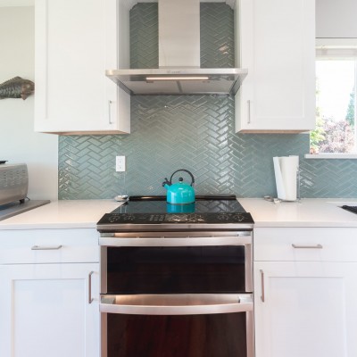 Bothell brushed nickel range hood remodeling design backsplash herringbone