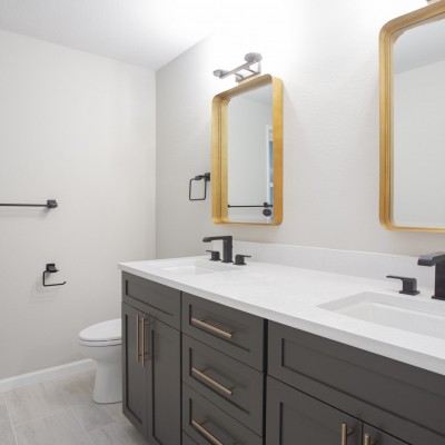 vanity gold mirror bothell huntwood quartz counters delta