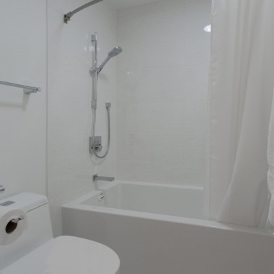 high efficiency toilet white bathroom minimalist remodel