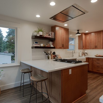 Large countertop over hang is a great for this eat in kitchen