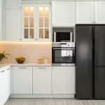 Kitchen with cabinets above the refrigerator