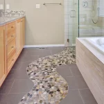Home Run bathroom with intricate bathroom flooring design